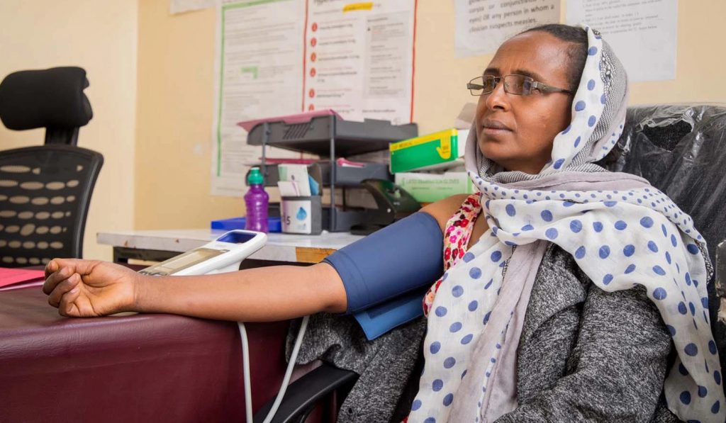 Woman getting her blood pressure measured